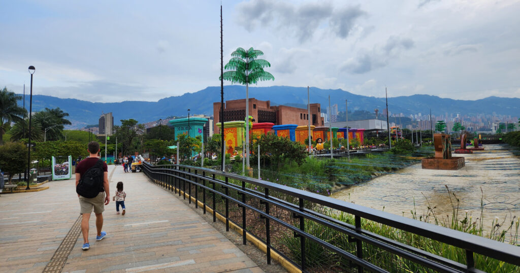Family walking in Parques del Río, Estadio, Medellín, Colombia