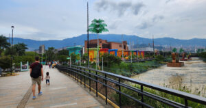 Family walking in Parques del Río, Estadio, Medellín, Colombia